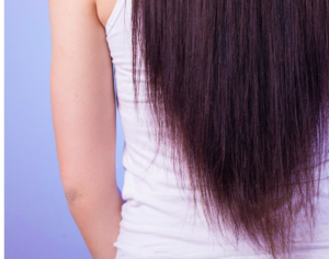 Back view of straightened deep burgundy red hair.
